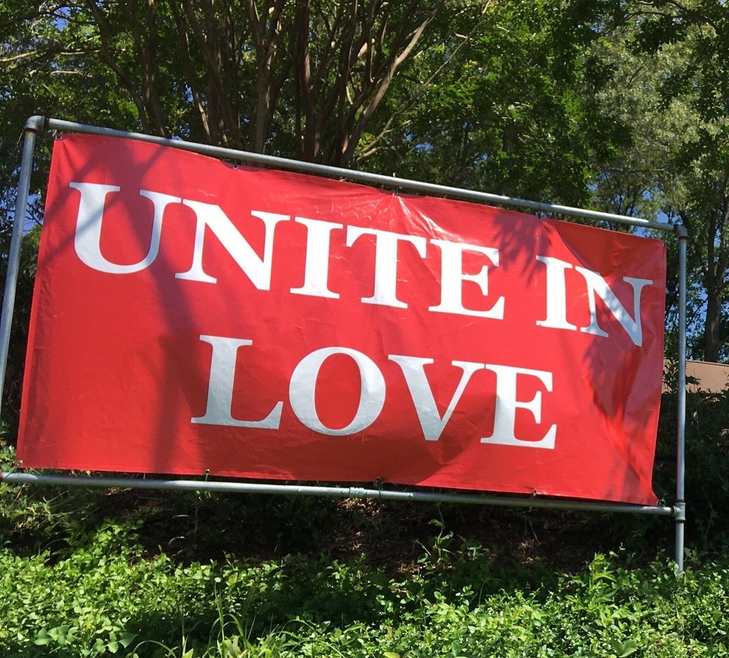 Outdoor banners saying Unite in Love and Black Lives Matter